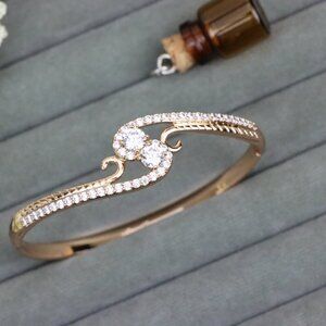 Rose Gold Bangle with Dual CZ Stones and Swirl Detail, XPBL0540